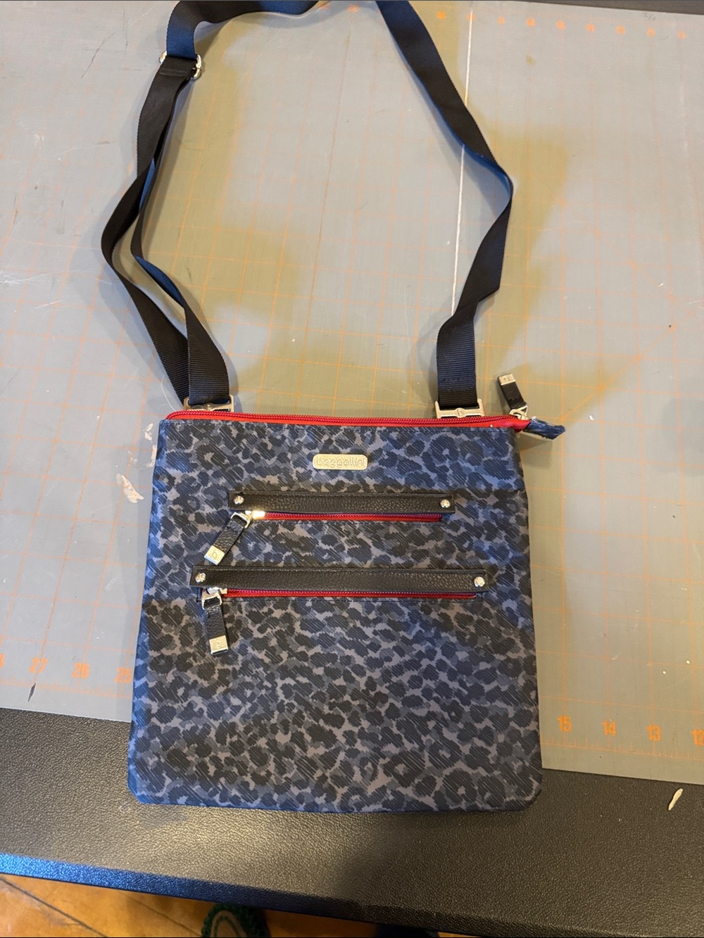 Baggallni Crossbody Bag with Blue/Black Leopard Print and Red Zippers